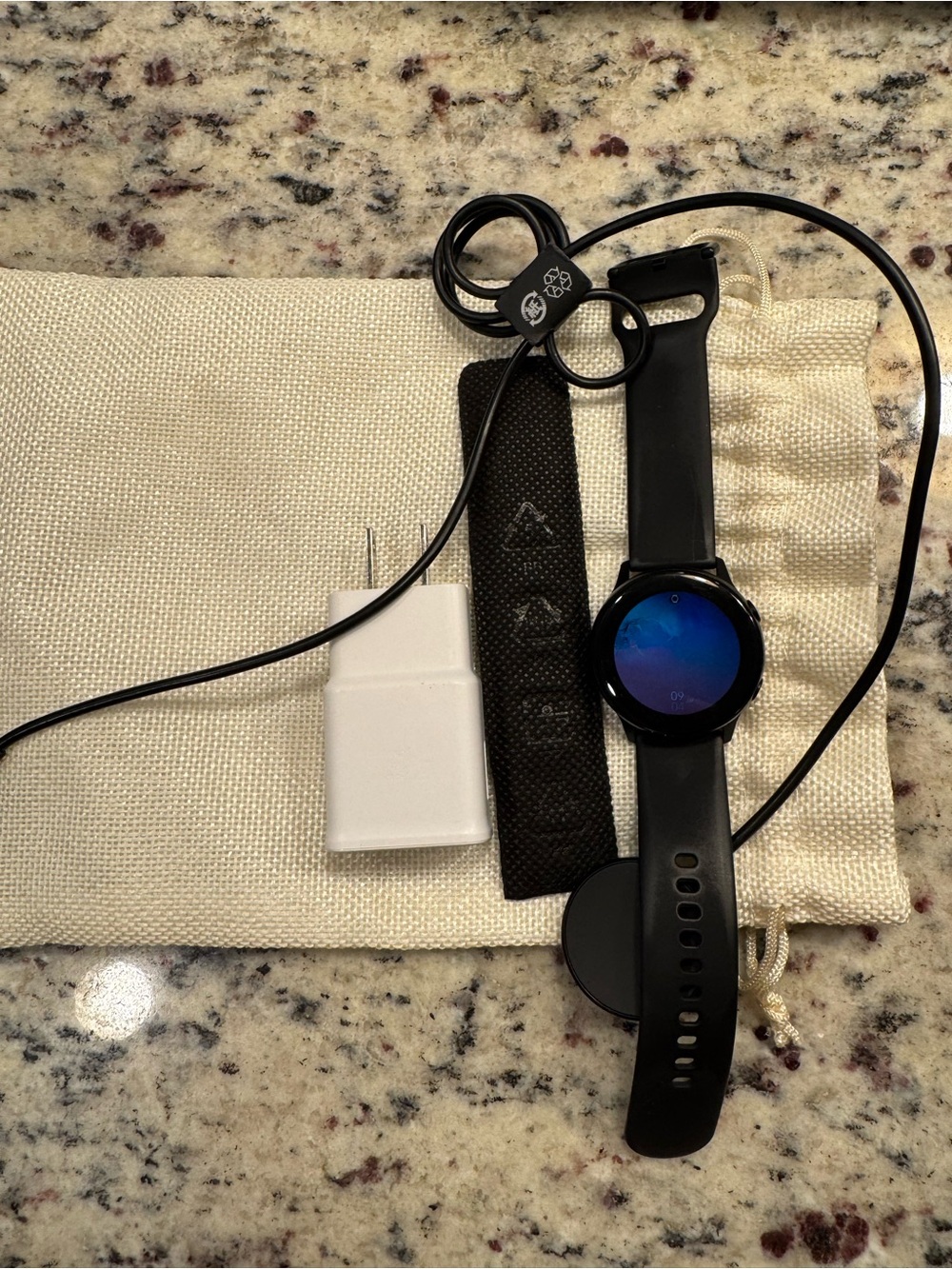 Samsung Black Smartwatch with Charging Cable and USB Adapter